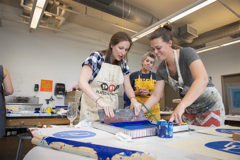 Participants learn printmaking