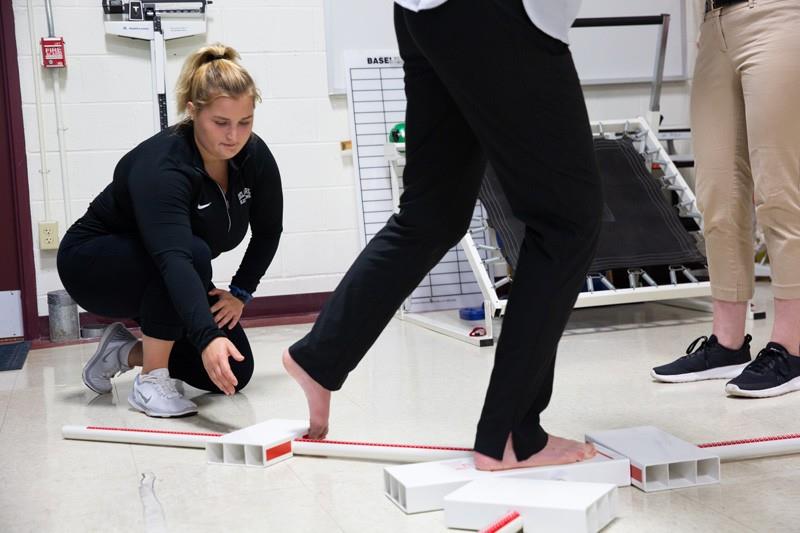 Alissa Strouse monitors a balance test