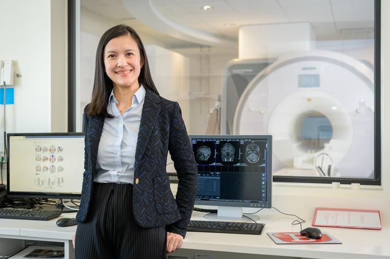 Zhenghan Qi with MRI instrument
