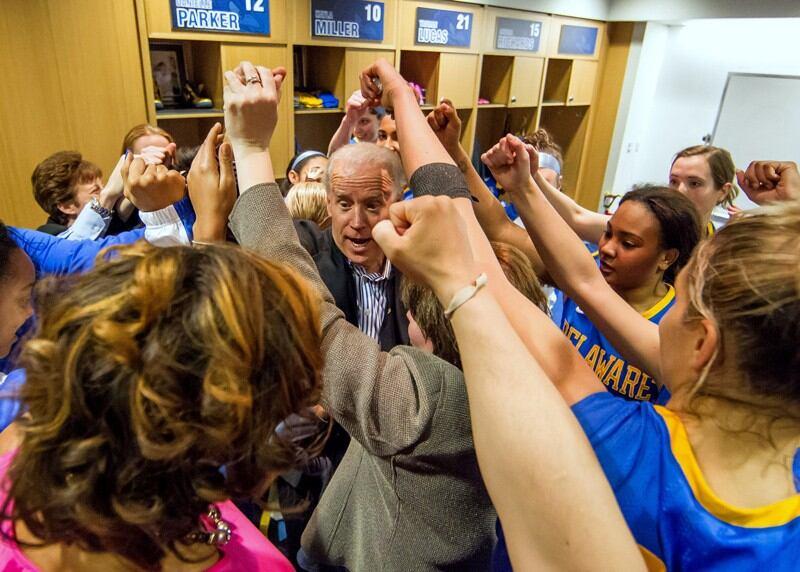 Then-Vice President Joe Biden helps the University of Delaware women's basketball team celebrate in 2013 after an NCAA tournament victory over North Carolina at the Bob Carpenter Center.