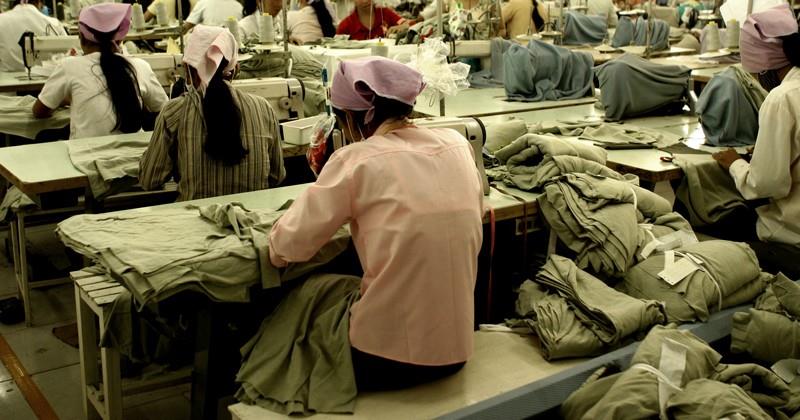 Workers sewing in a factory