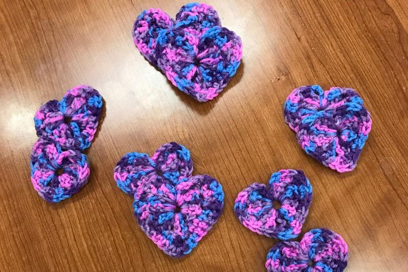 Several small crocheted hearts