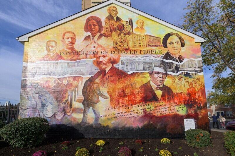 mural of Black American historical figures on a building