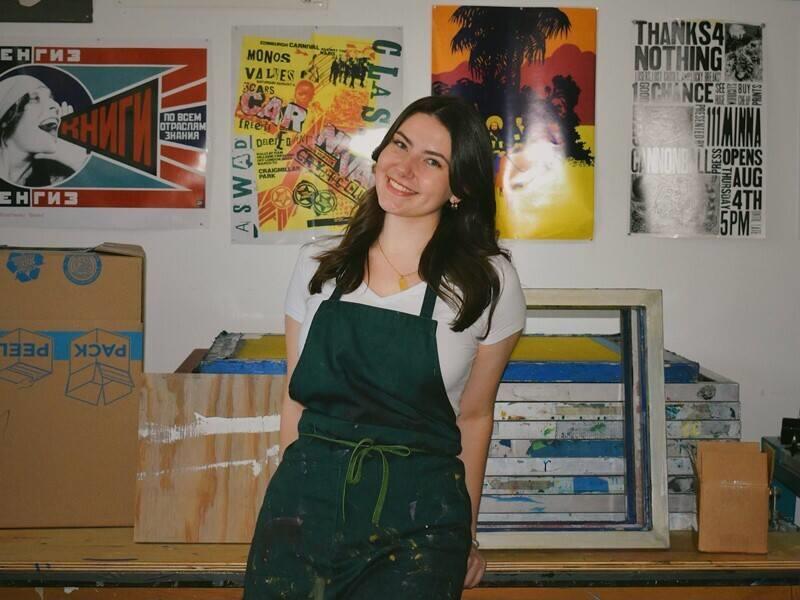 student standing in an art room