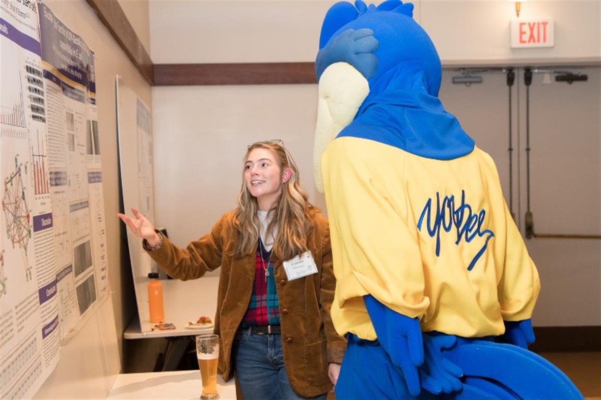Bio Student with UD mascot YouDEE at Research Day